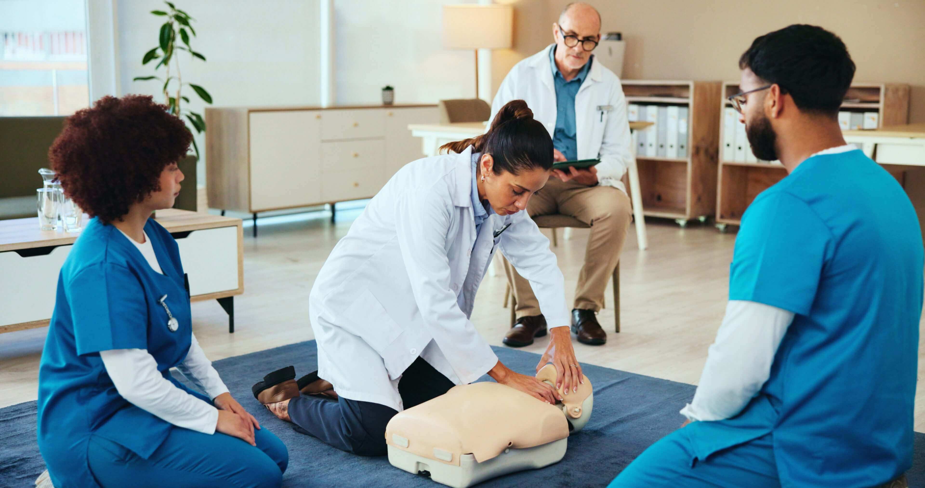 Doctors practicing CPR on a dummy mannequin.